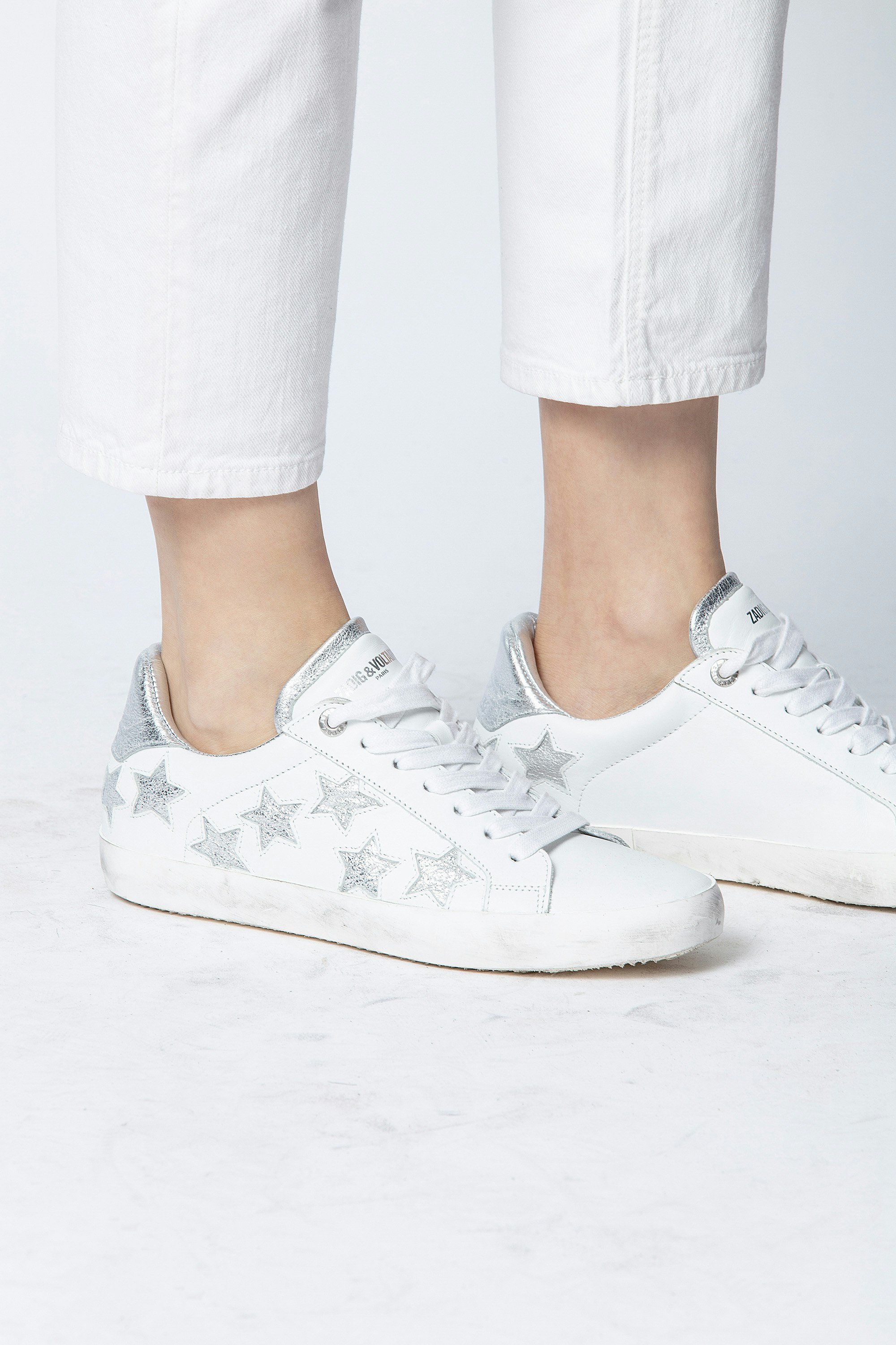white sneakers with stars on them
